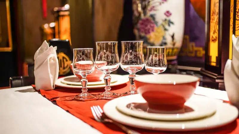 Elegant restaurant table set with wine glasses